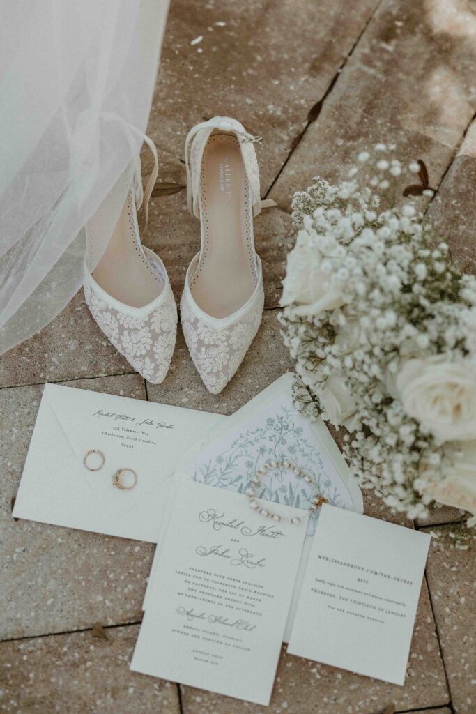 Flat lay of wedding invitation suite by Paper Daisies Stationery