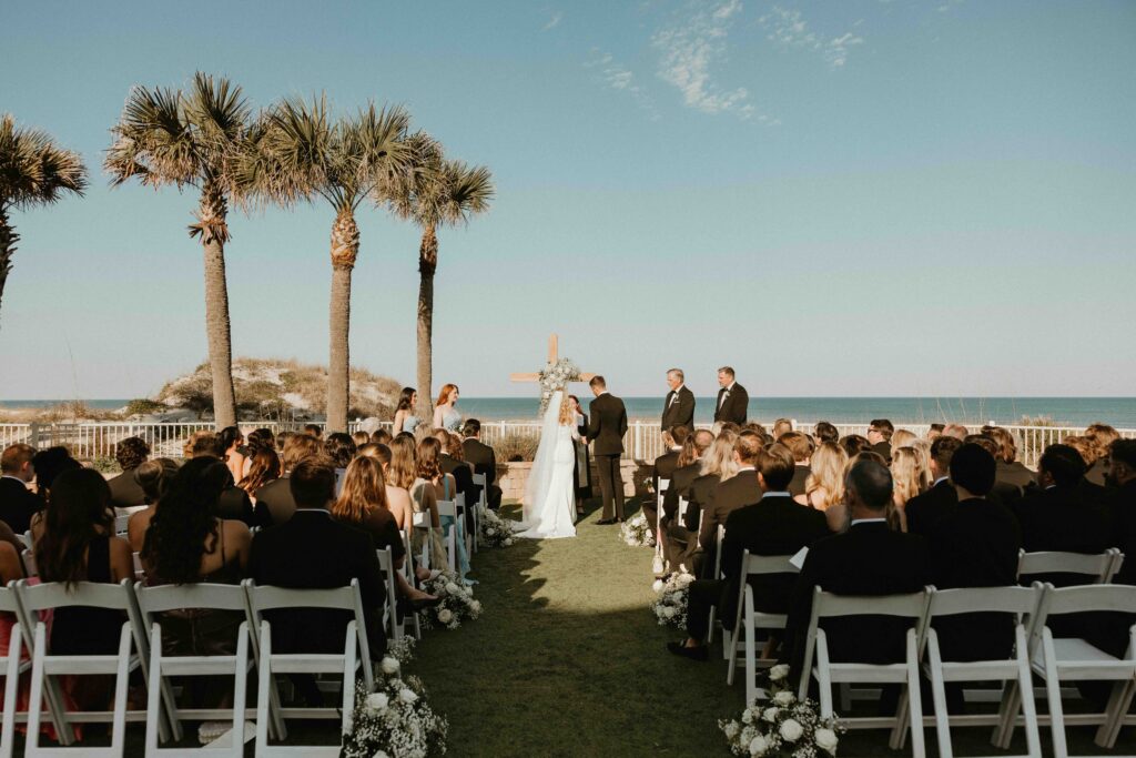 Bride and groom exchanging vows at Amelia Island Club beachfront ceremony