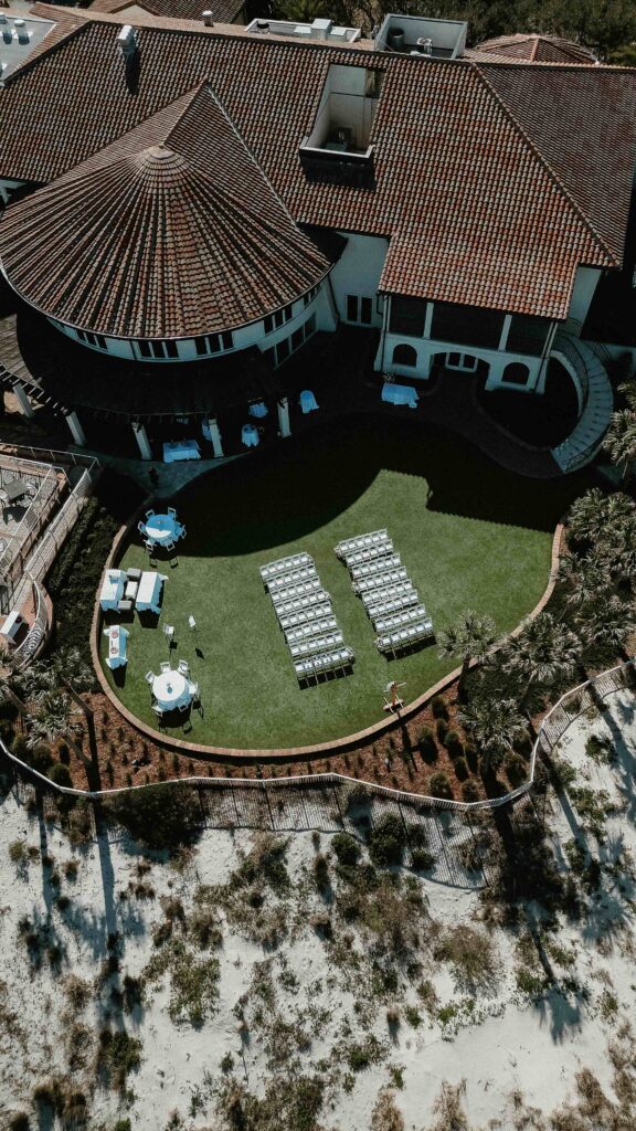Drone view of Amelia Island Club wedding ceremony with ocean backdrop and coastal landscape